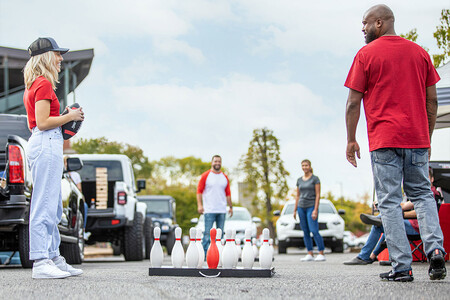 People playing portable Fowling set